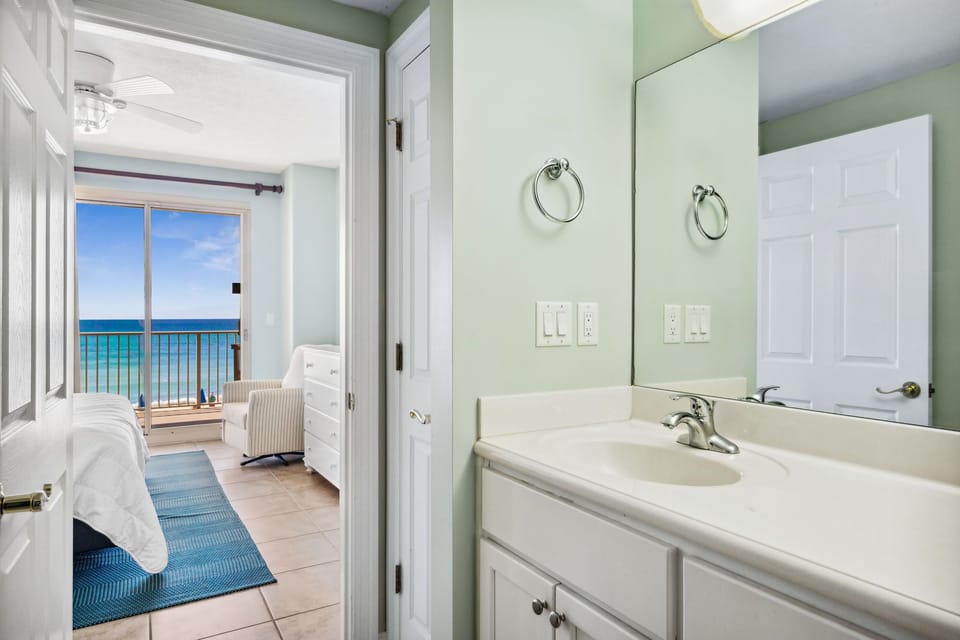 Convenient vanity area connecting the bathroom to the bedroom for added ease