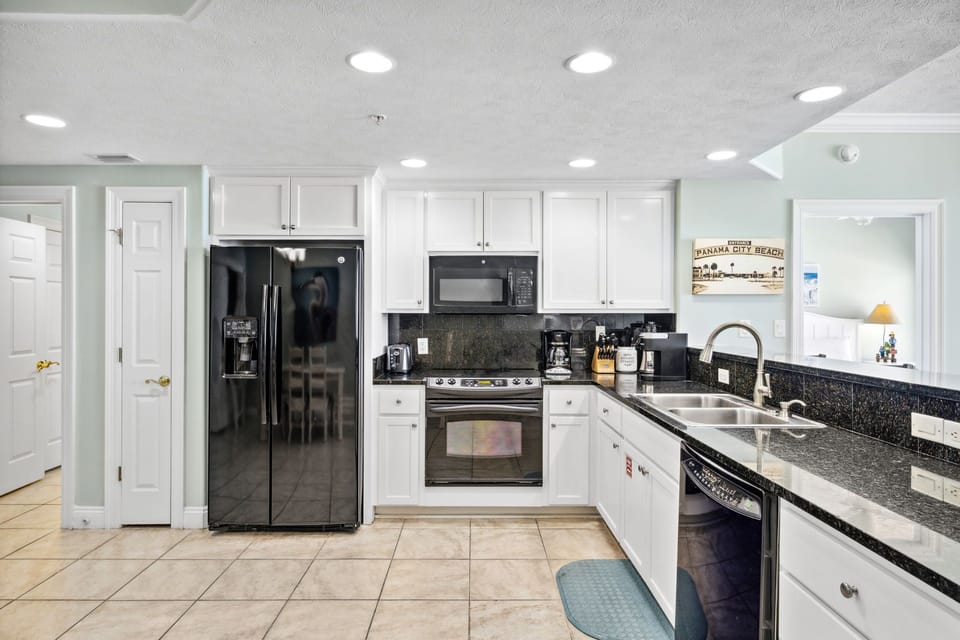 Cook with ease in the bright kitchen featuring ample counter space & storage
