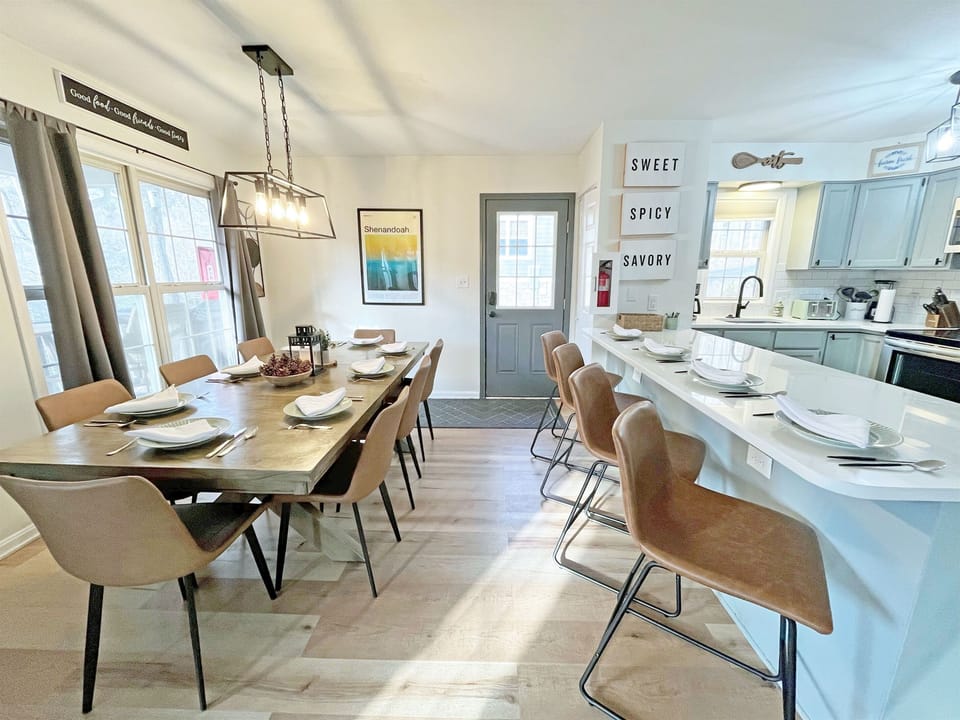 Dining table, kitchen and breakfast bar.