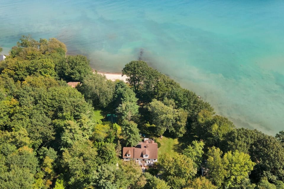 Tons of trees surrounding the home making a large shady yard! There are great spots to sunbathe too!