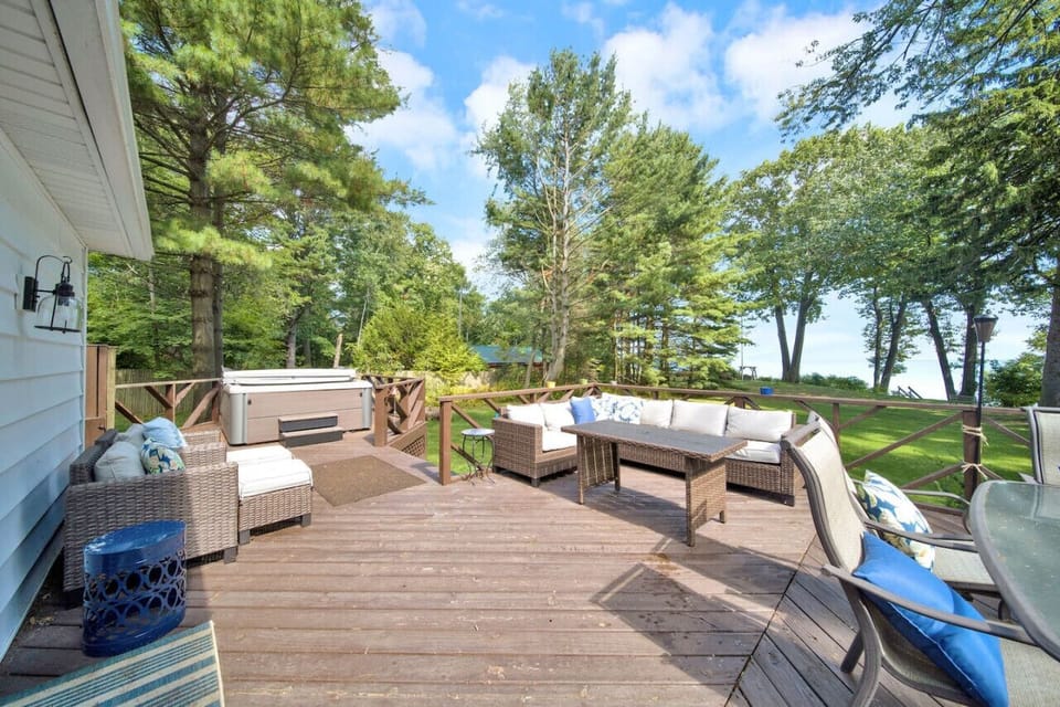 Large deck off the back of the home with a hot tub!