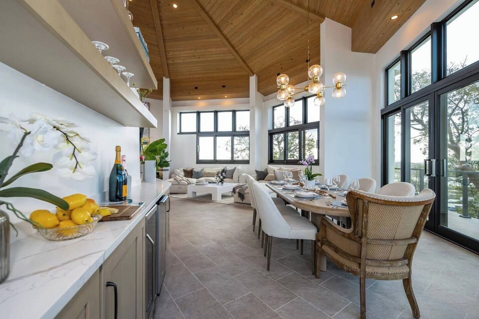 Enjoy our cocktail area with beverage fridge, ice maker, wine and cocktail glasses, and space for all of your libations! 