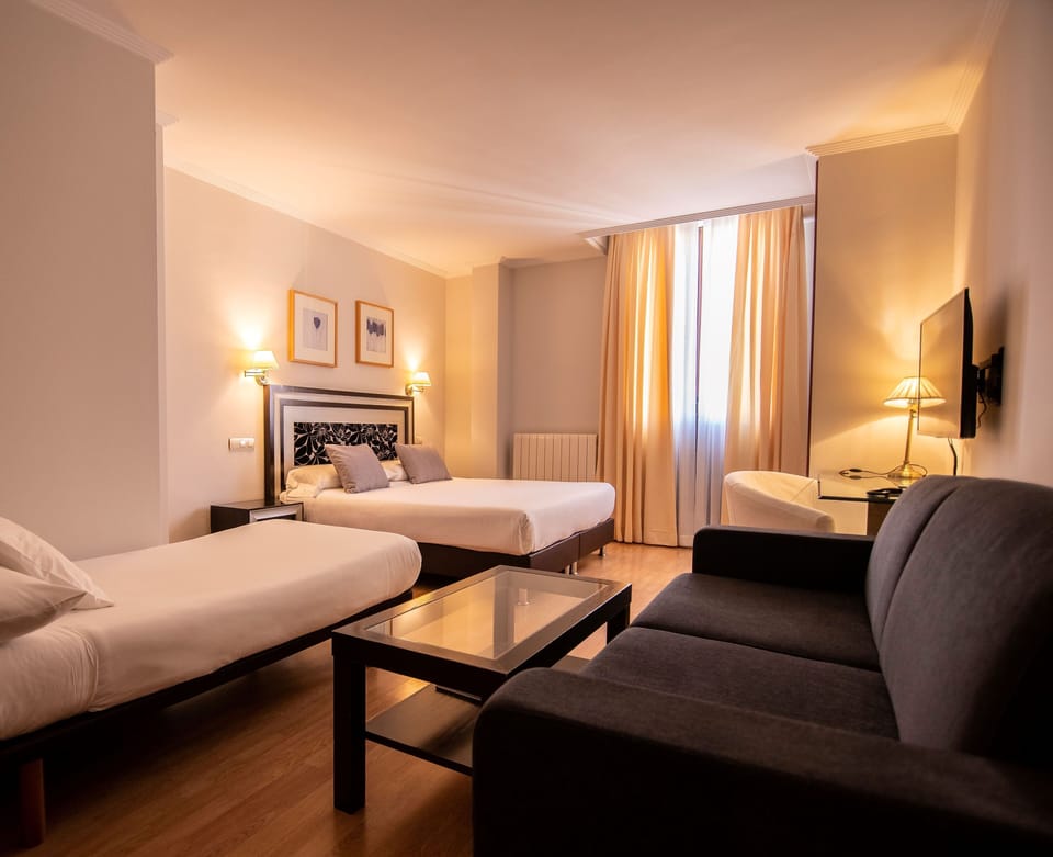 Superior Triple Room | Minibar, in-room safe, desk, soundproofing