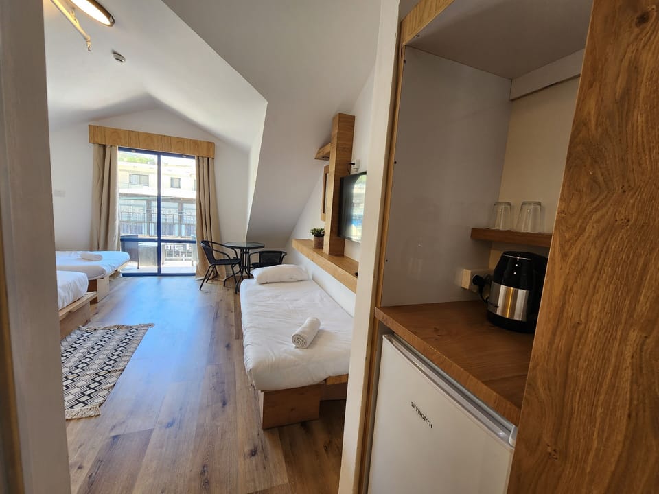 Deluxe Studio, Balcony, Mountain View | Minibar, in-room safe, individually furnished, desk