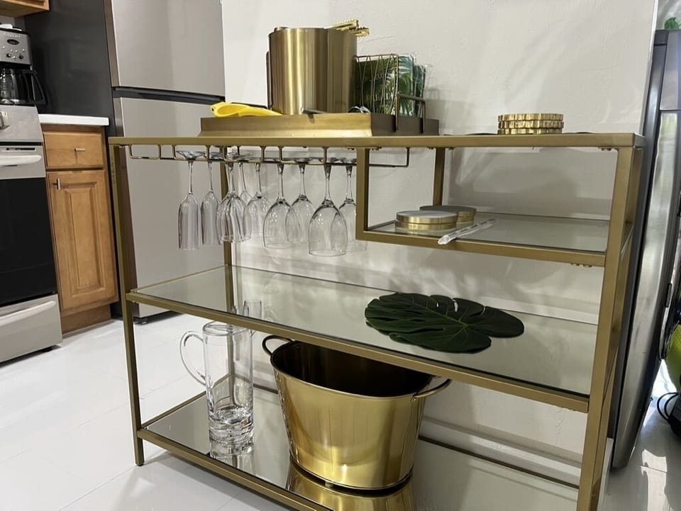 Modern dry bar with gold accents 