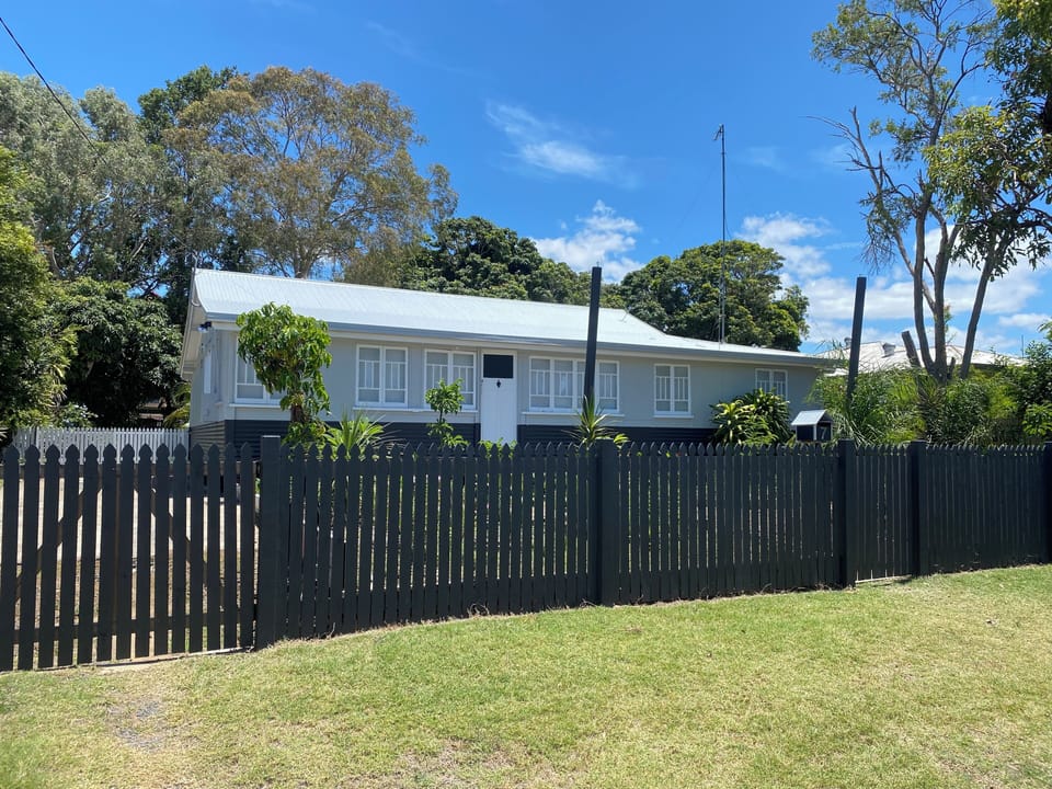 Front view of the house. Full fenced front area too. 