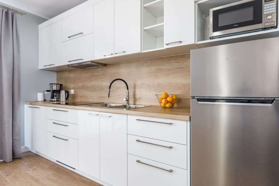 Fully equipped kitchenette with a dining area.