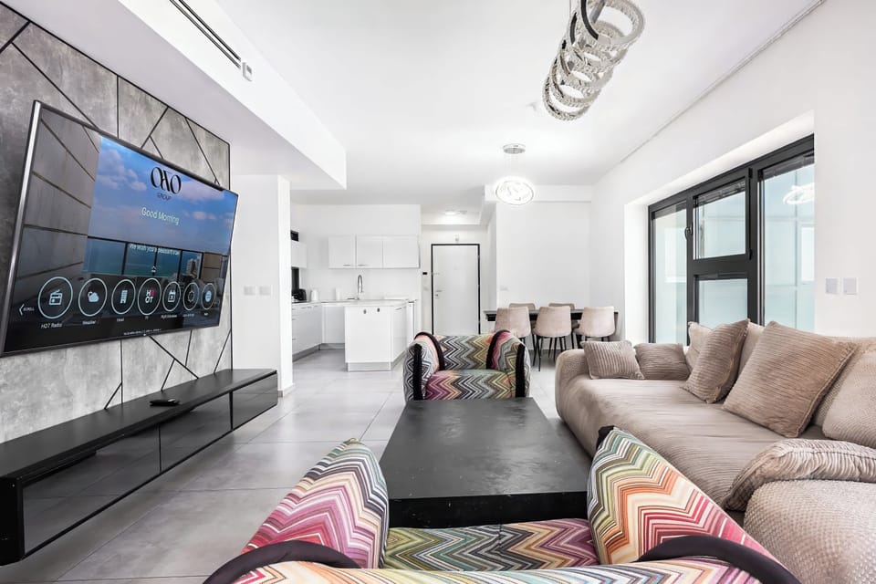 Open living and kitchen layout keeps everyone connected, whether relaxing on the sofa or gathering.