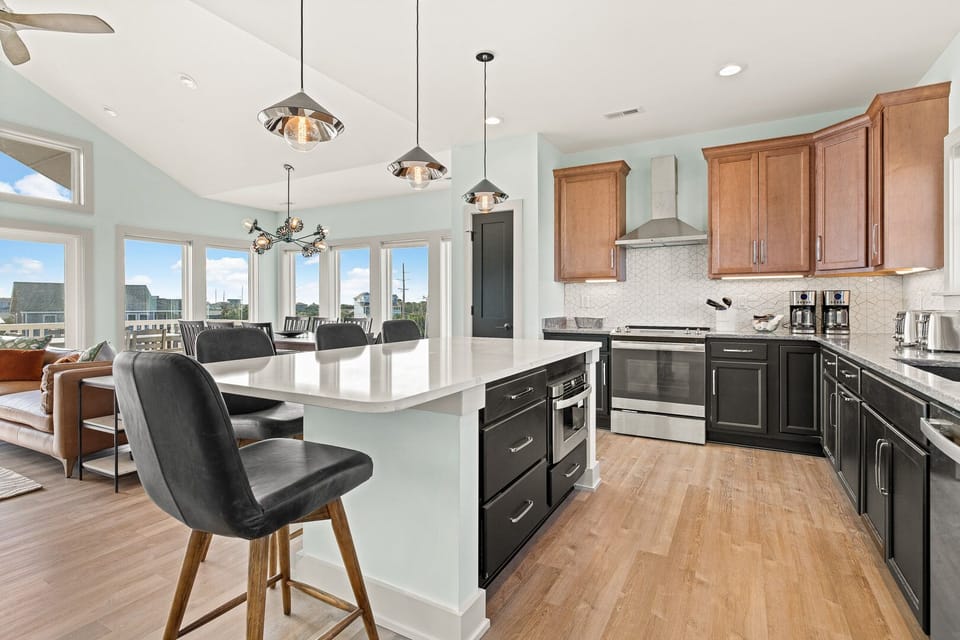 Modern Kitchen with Bar Stool Seats on Third Level