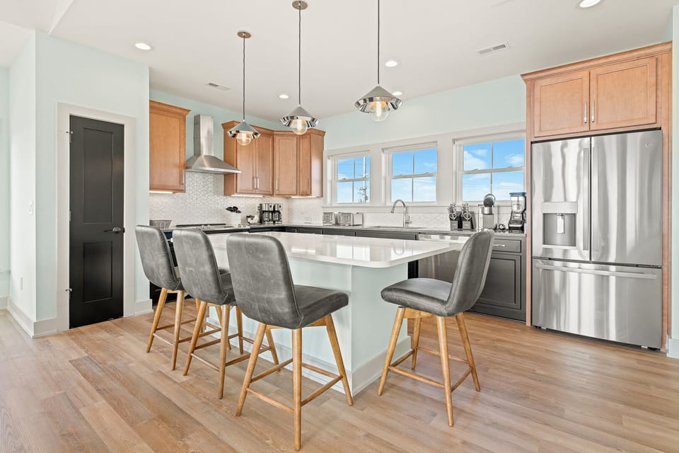 Modern Kitchen with Bar Stool Seats on Third Level