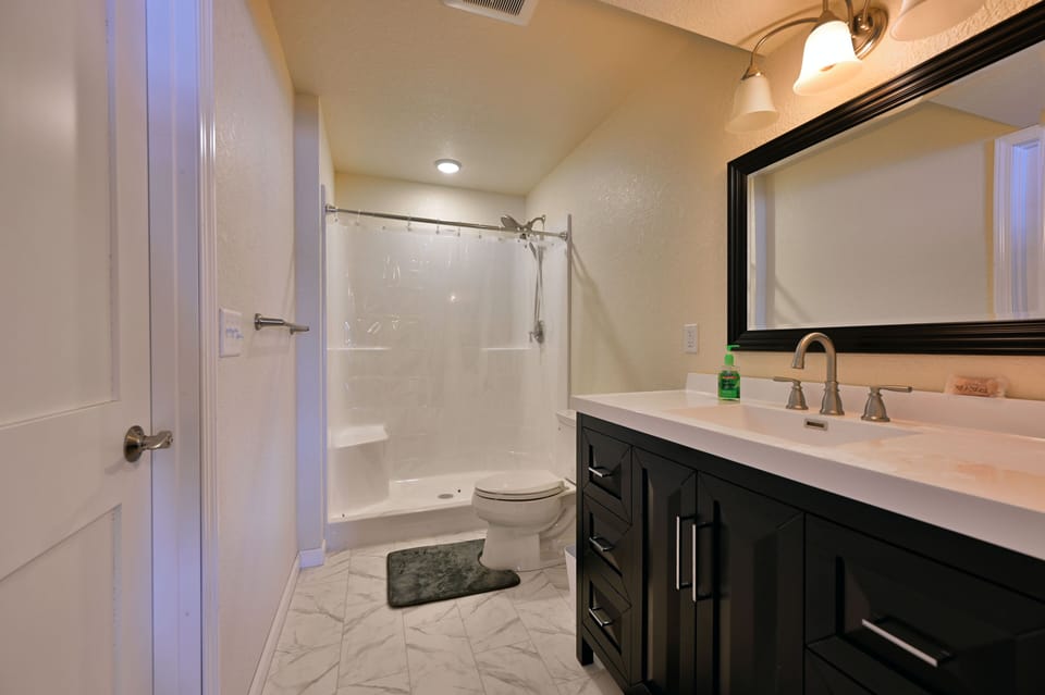 Downstairs bathroom with walk in shower.