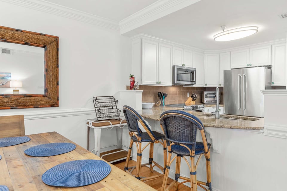 The dining area with seating for 6 and countertop seating for 2