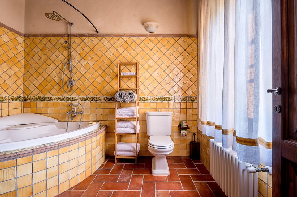 Deep soaking tub, rainfall showerhead, hair dryer, bidet