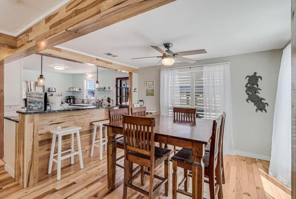 Dining area with natural light and seating for family gatherings.