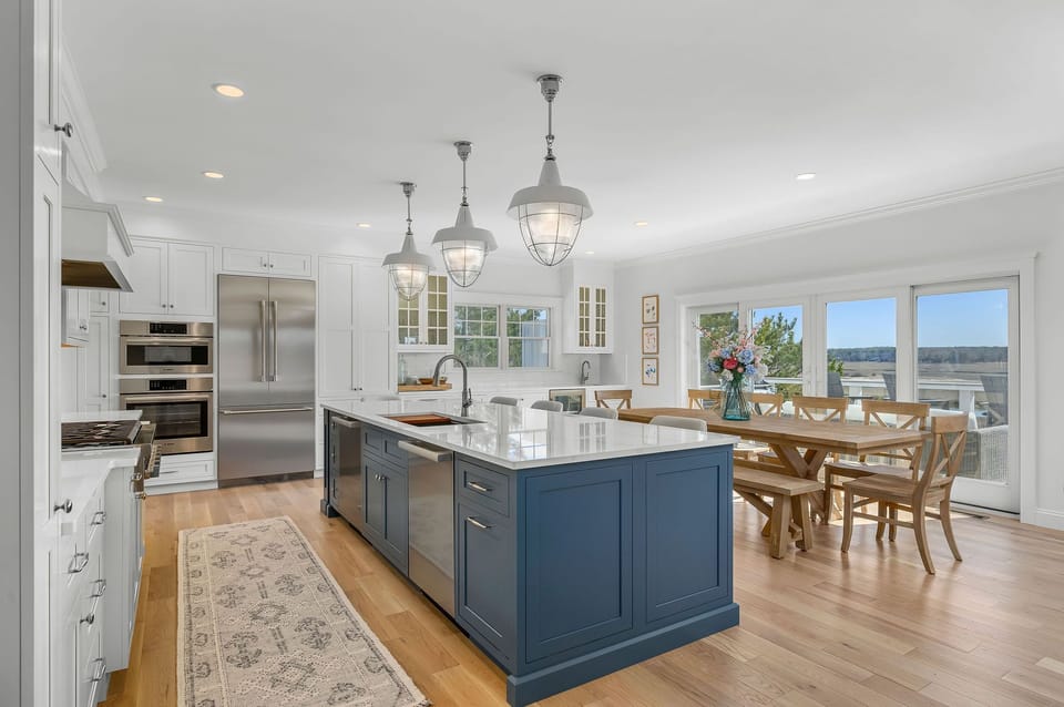 Gourmet kitchen with island seating for 5 and dining seating for 10