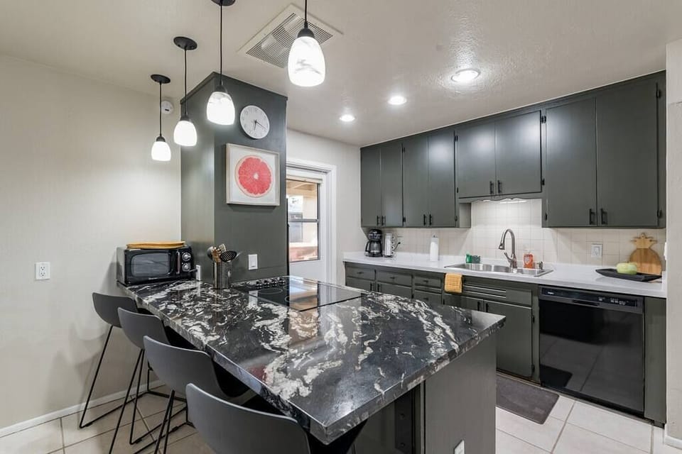 Fresh countertops keep this cute kitchen feeling modern and fresh, while still retaining some of the charm of the original kitchen