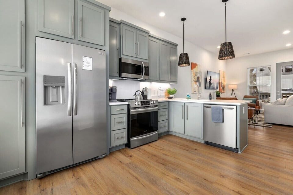 Upon entering our home, you'll be greeted by our staircase, which leads to the second and third floors. On the second floor, enjoy our open-concept kitchen, living room and dining area!