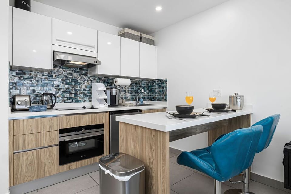 Cook your favorite dishes in this modern kitchen, complete with a stylish breakfast bar where you can enjoy your morning coffee while planning the day's adventures.