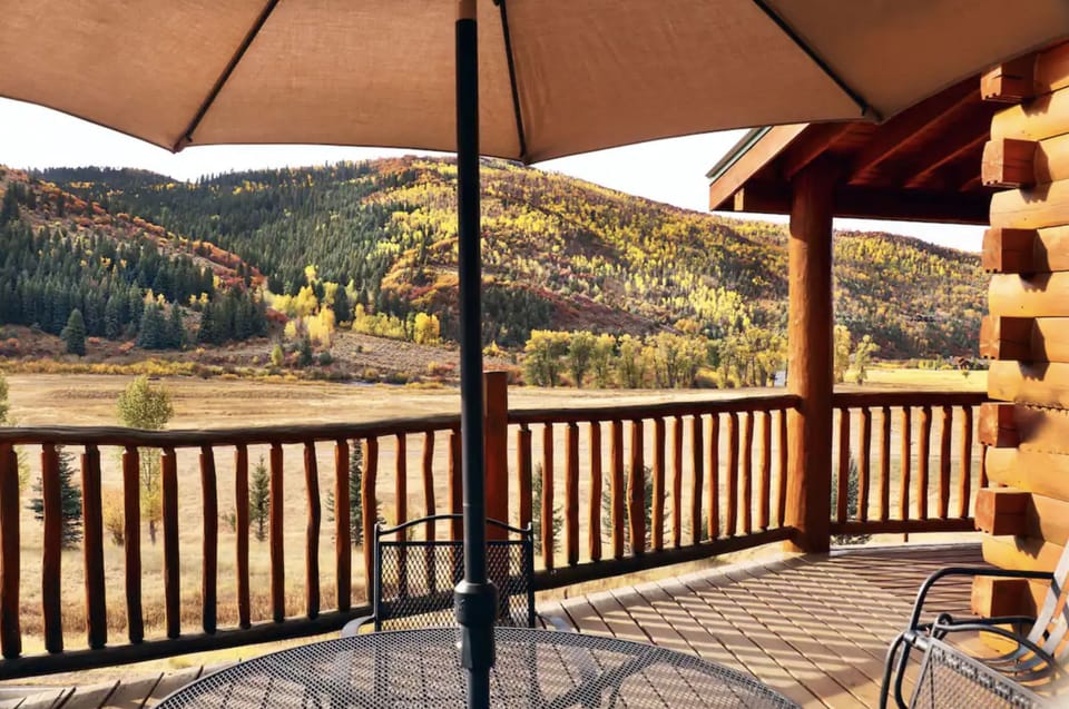 Beautiful deck with views. Outdoor seating, umbrella, and outdoor gas grill.