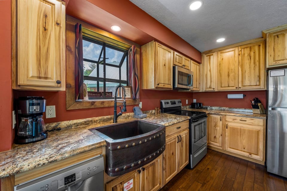 Open layout kitchen with custom copper sink