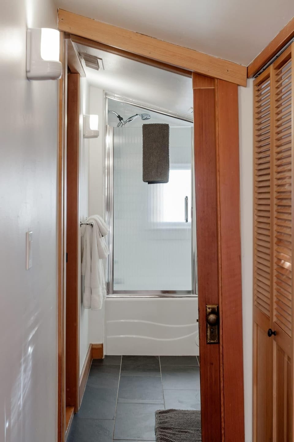 Entrance to the single bathroom from the laundry area. If you are over 6ft, please watch your head in this doorway.