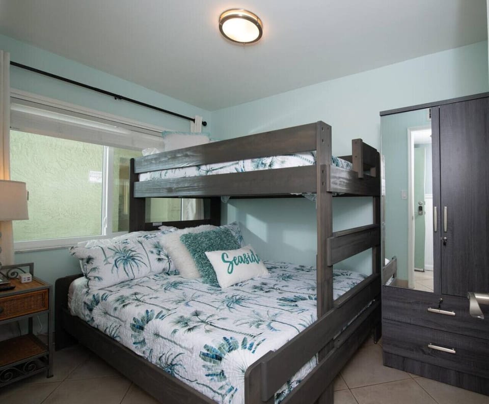 Bunk room w/ sturdy bunks & nautical bedding, perfect for kids or extra guests.