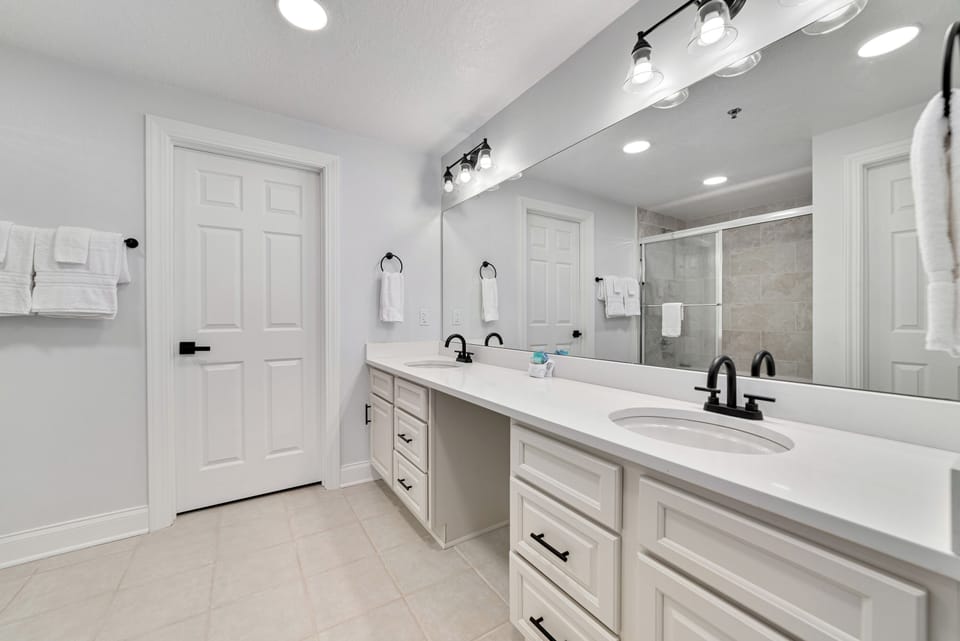 A well-appointed bathroom featuring convenient double sinks, offering ample space and functionality for daily routines.