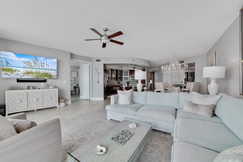 This thoughtfully designed living space maximizes natural light and integrates seamlessly with the surrounding environment. The open-concept layout and expansive windows create a bright and airy atmosphere.
