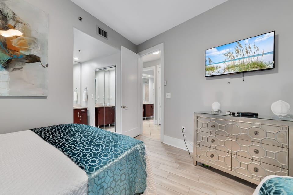 A charming guest room featuring two comfortable full-size beds, perfect for sharing and relaxation after a day of coastal adventures.