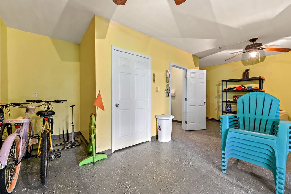 room under house showing door to 1/2 bathroom