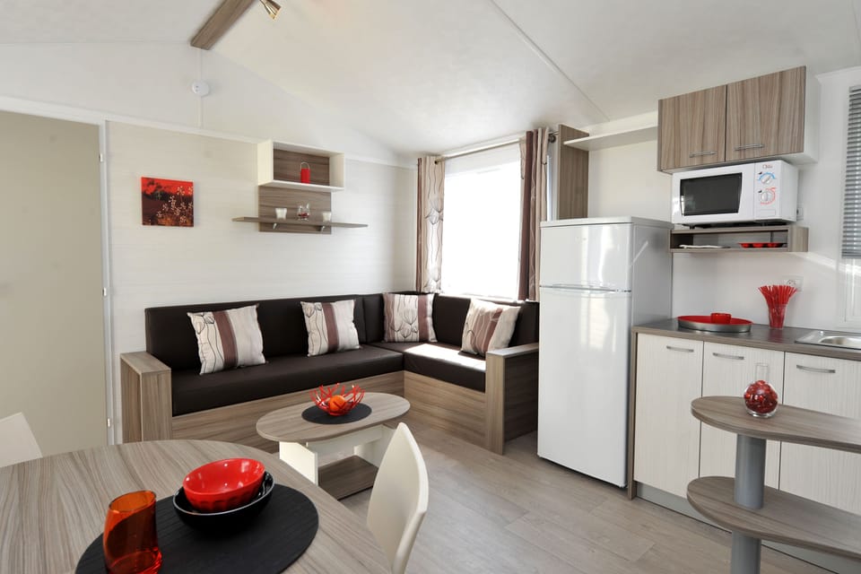 Bright, modern living area with an open kitchen, creating a welcoming and functional space.