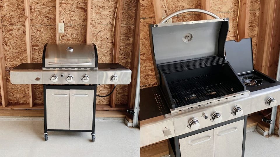 New propane grille with extra tank - stored in garage, pull out into the driveway, use, and return.
