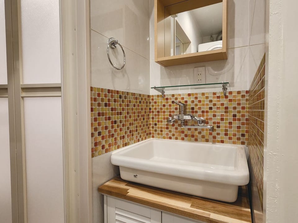 Separate tub and shower, free toiletries, hair dryer, slippers