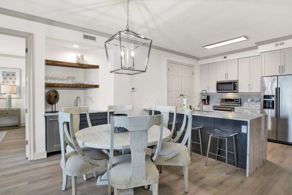Kitchen dining for 6 + 4 barstools + 8-seat dining on patio