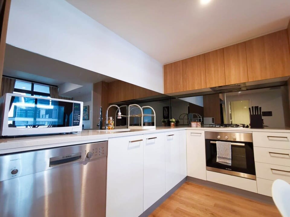 Large and fully-equipped kitchen featuring 4 burner gas cooktop, oven, dishwasher and plenty of preparation space. Comes equipped with everything you need to prepare and enjoy a delicious meal! 