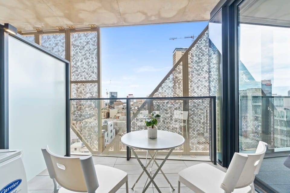 Balcony with city view. Sip the wine in a lazy afternoon