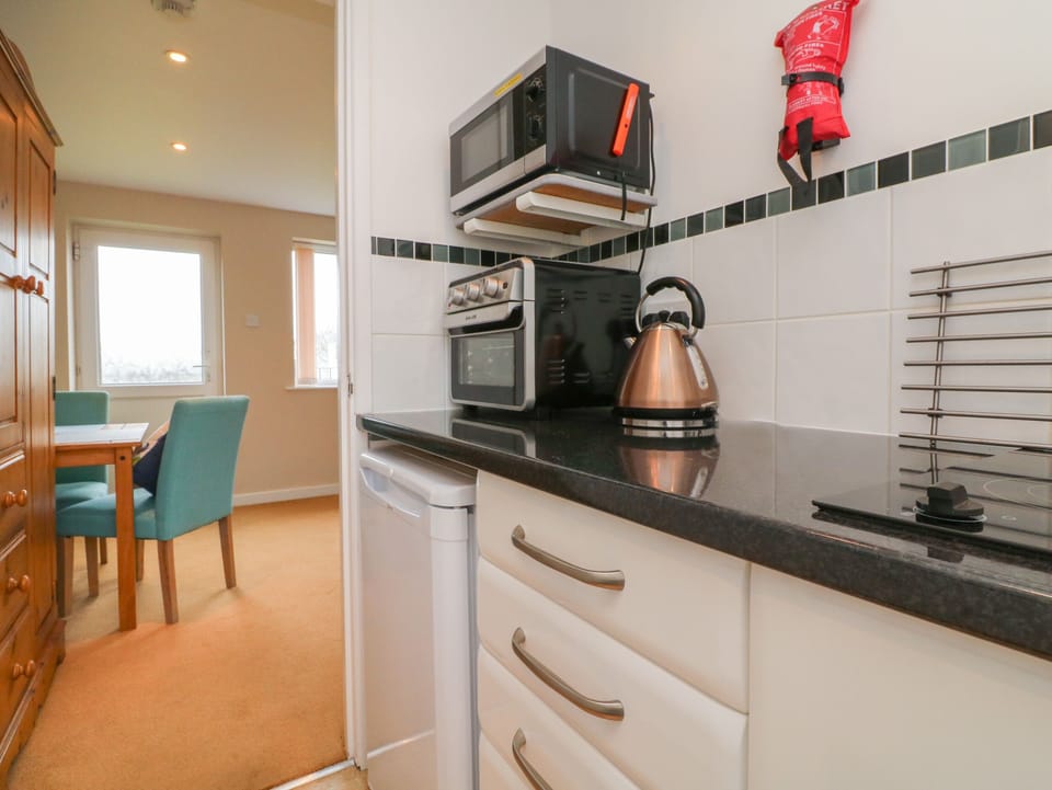 Fridge, electric kettle, toaster, cookware/dishes/utensils