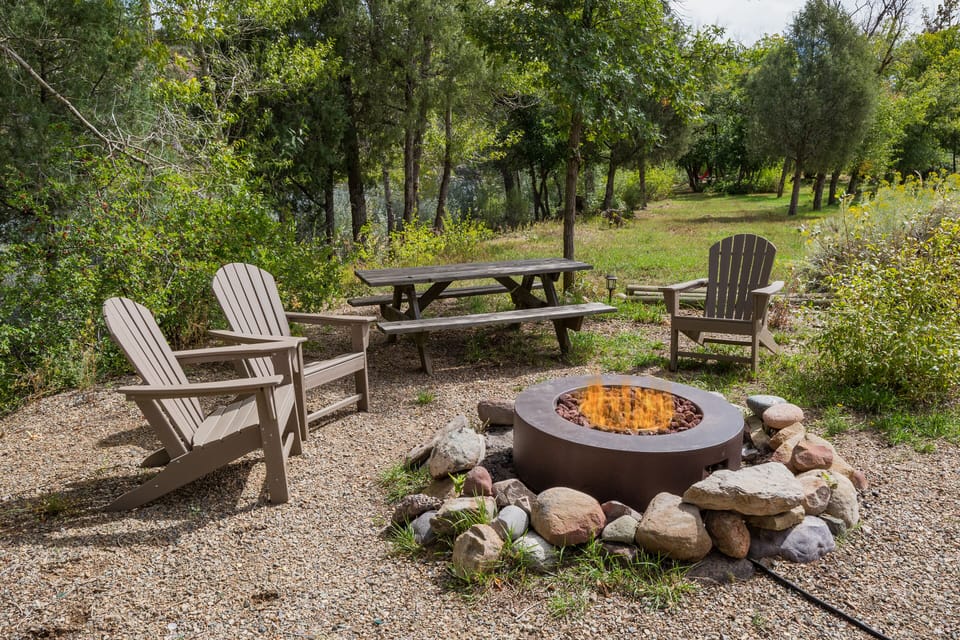 Gas firepit with seating on the Animas River