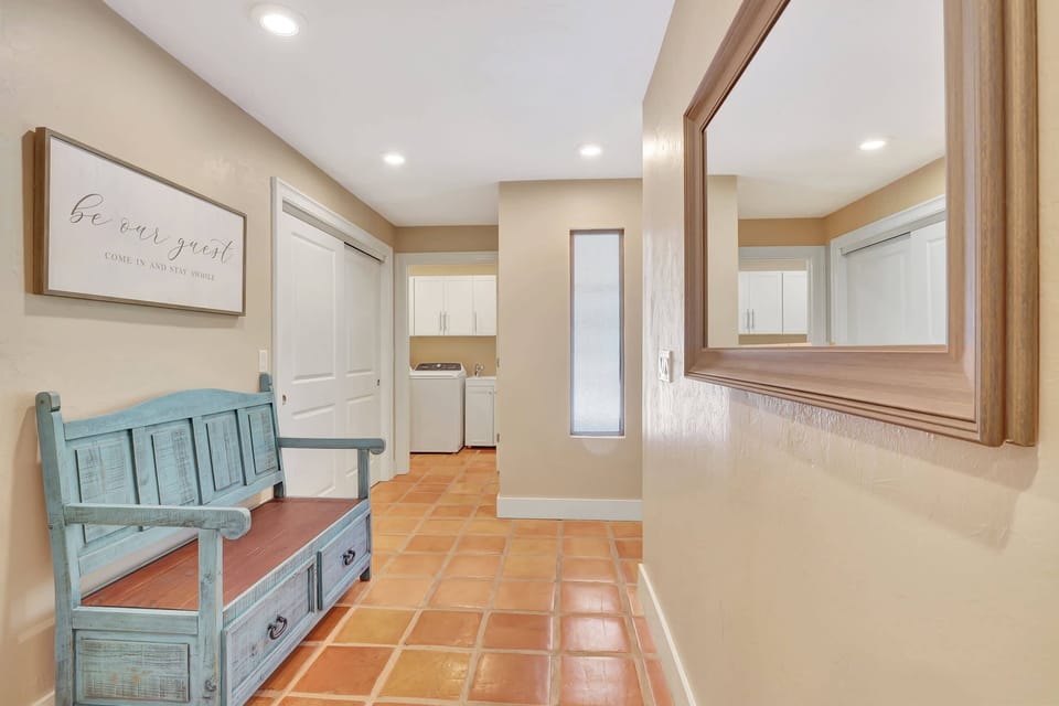 The Front Hallway Also Leads to the Bedrooms and Laundry Room to the Left
