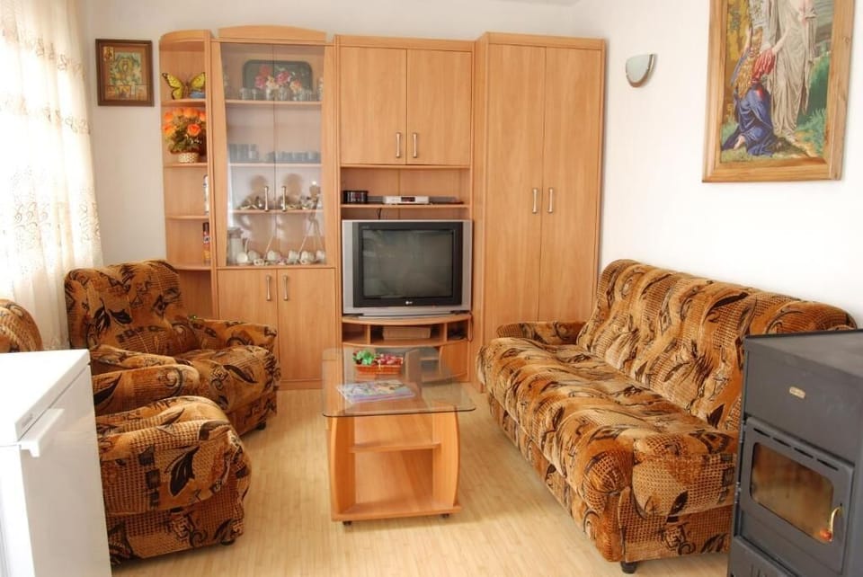 Standard Quadruple Room | Living area | 42-inch LCD TV with cable channels, TV, toys