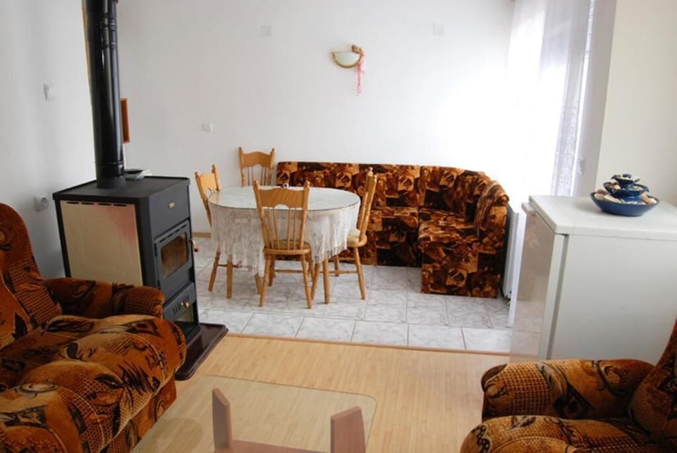 Standard Quadruple Room | Living area | 42-inch LCD TV with cable channels, TV, toys