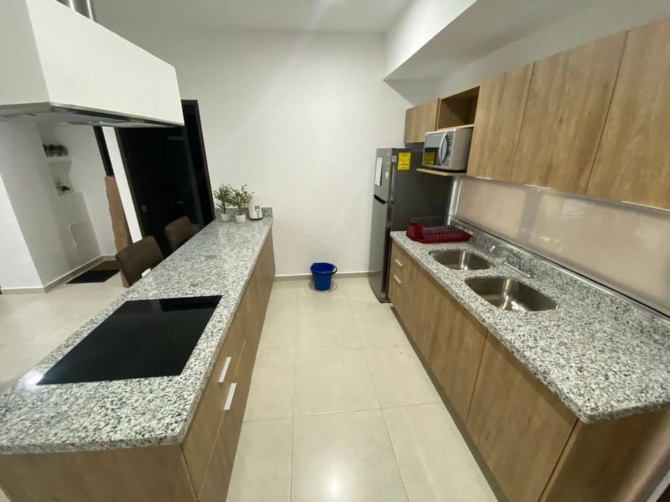Comfort Condo | Private kitchen | Cookware/dishes/utensils, dining tables
