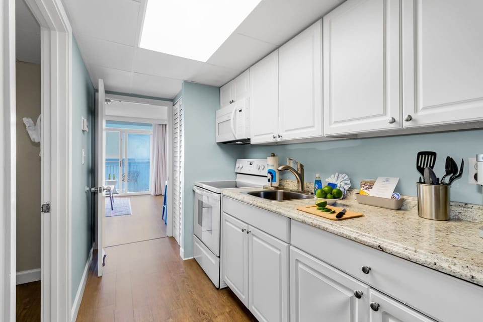 Cook up delicious meals in this fully equipped kitchen featuring granite countertops, modern appliances, and plenty of cabinet space. Whether it's a quick breakfast or a gourmet dinner, this space has everything you need!
