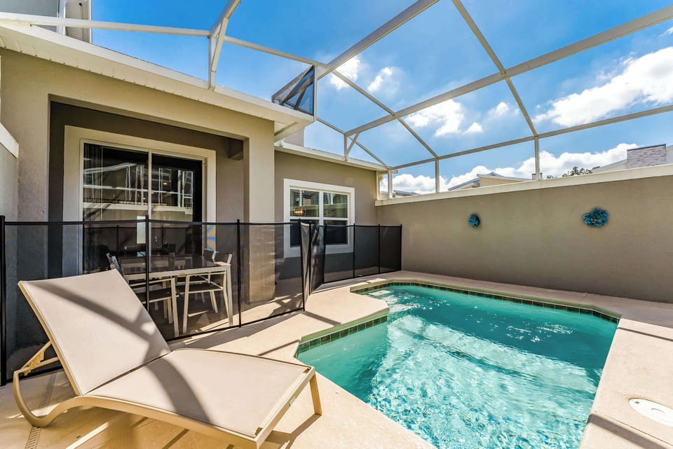 Enjoy a relaxing day by your private pool, complete with a lounge chair and dining area under the sun.