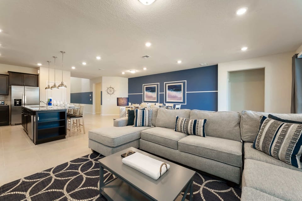 Experience luxury in this spacious living area with a modern kitchen and stylish decor, perfect for gatherings.