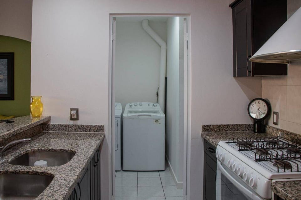 Family Condo | Private kitchen | Cookware/dishes/utensils, dining tables