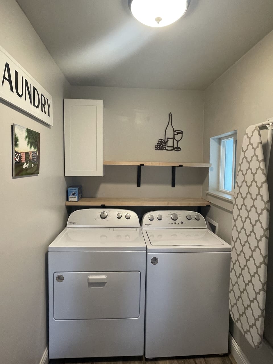 Updated laundry room with new washer/dryer and supplies.
