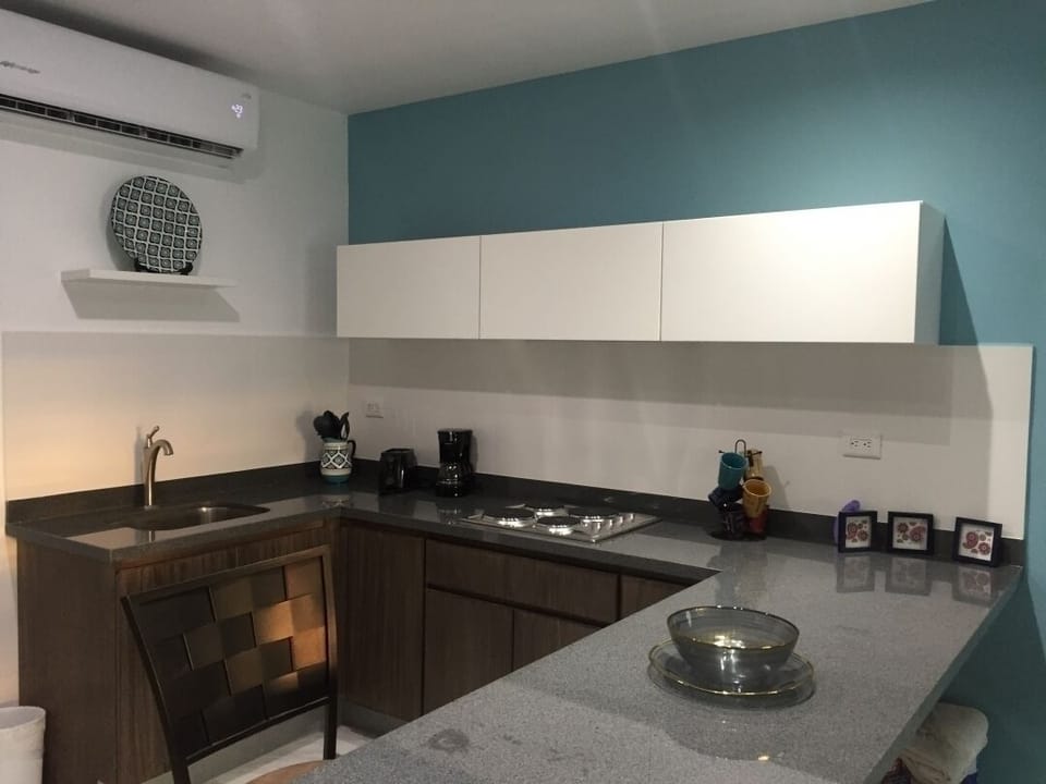 Family Condo | Private kitchen | Cookware/dishes/utensils, dining tables