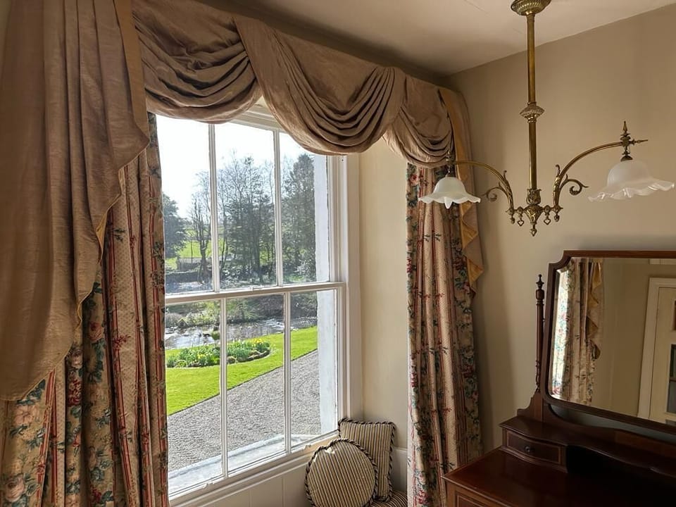 Bedroom 4 and view of beck and garden