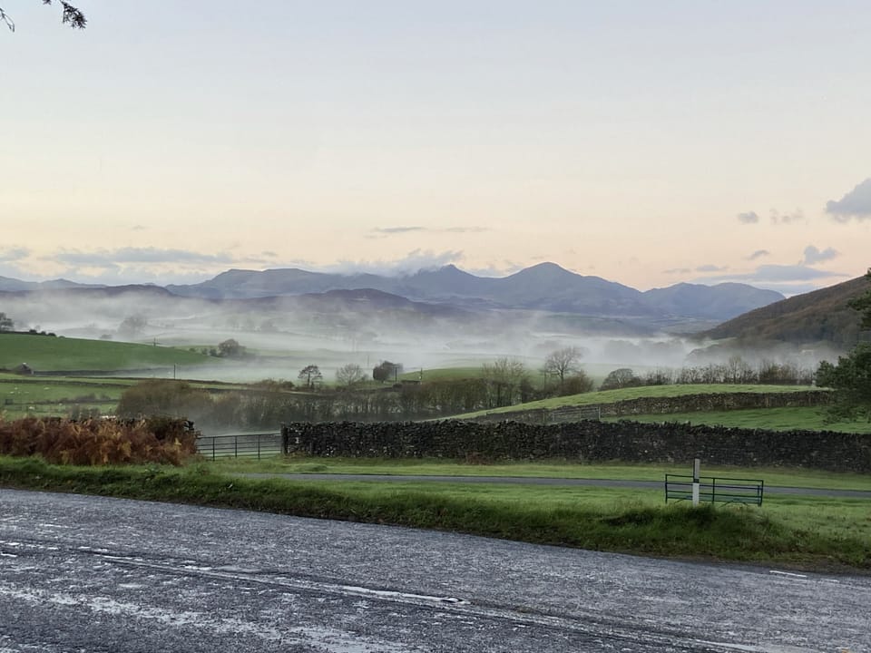 View from the village green opposite the house of the Coniston mountain range 
